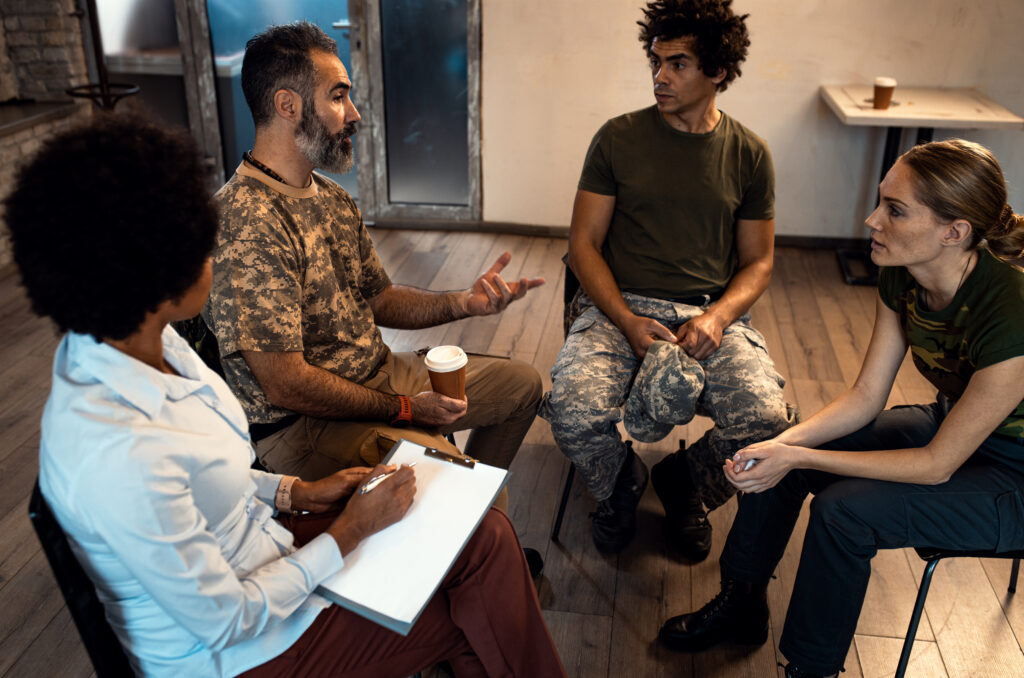 Image of a diverse group of people engaged in open discussion, sharing their experiences with mental health and addiction. They sit together, demonstrating solidarity and support, illustrating the theme of overcoming social stigma through shared dialogue and education.