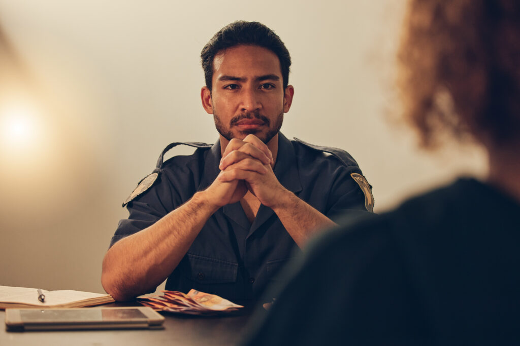  A police officer receives empathy and support from others, highlighting the importance of vulnerability and empathy in policing. This image accompanies the section of the blog discussing the significance of vulnerability and empathy in public safety.