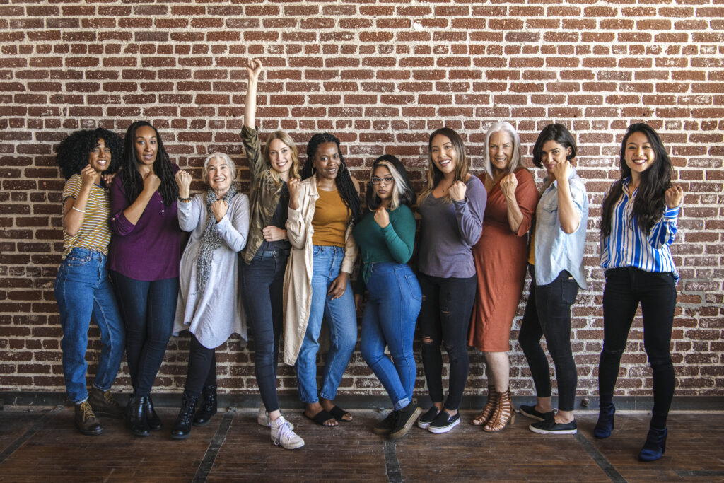 Diverse group of women standing together in unity, showcasing strength and resilience at the Ohana Women's Recovery Center in Agoura Hills.