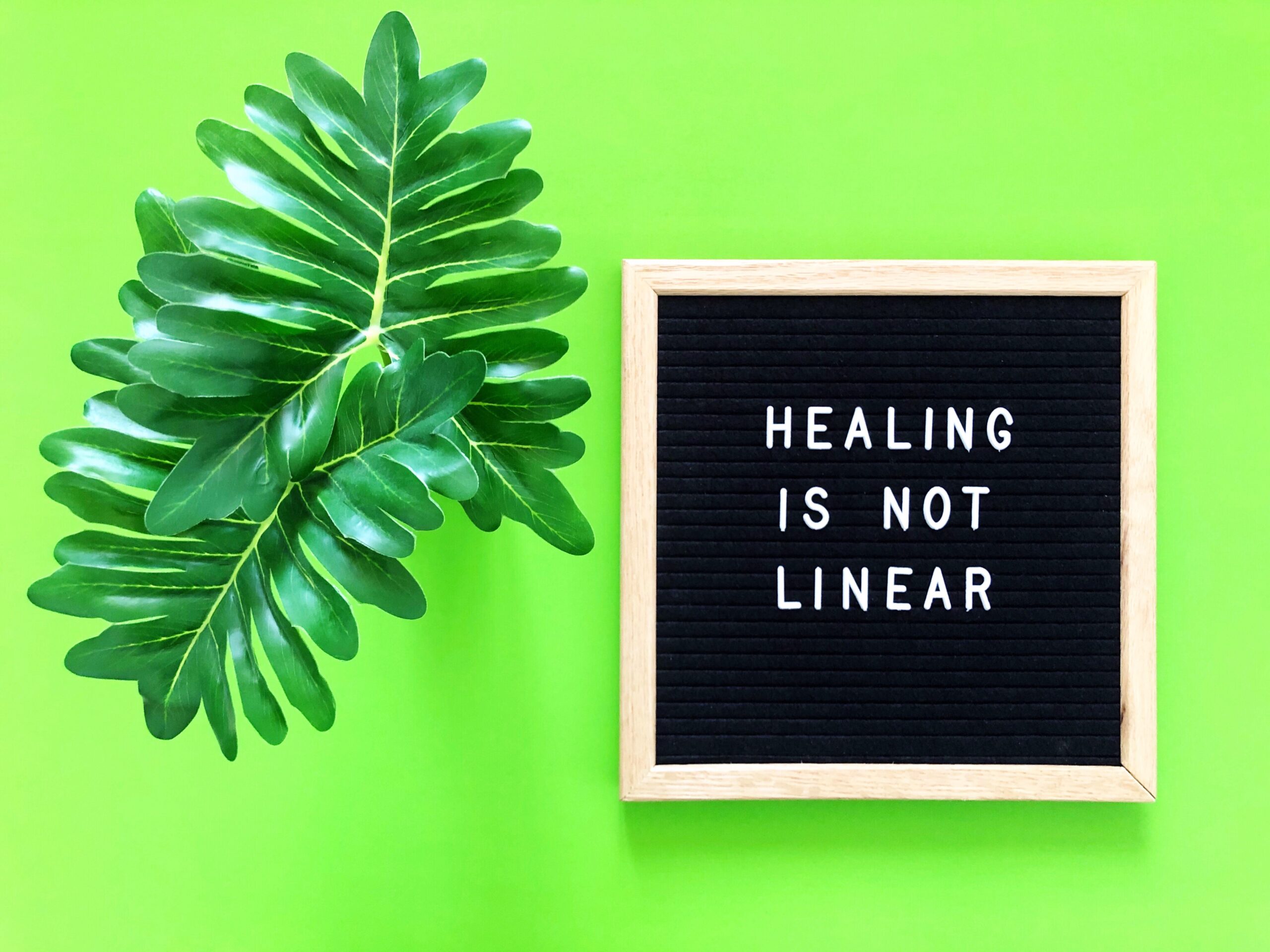 Sign with the message "Healing is not linear" representing the journey of holistic treatments in mental health care.