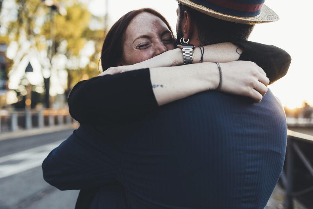 Two people sharing a supportive hug, demonstrating emotional connection and understanding.