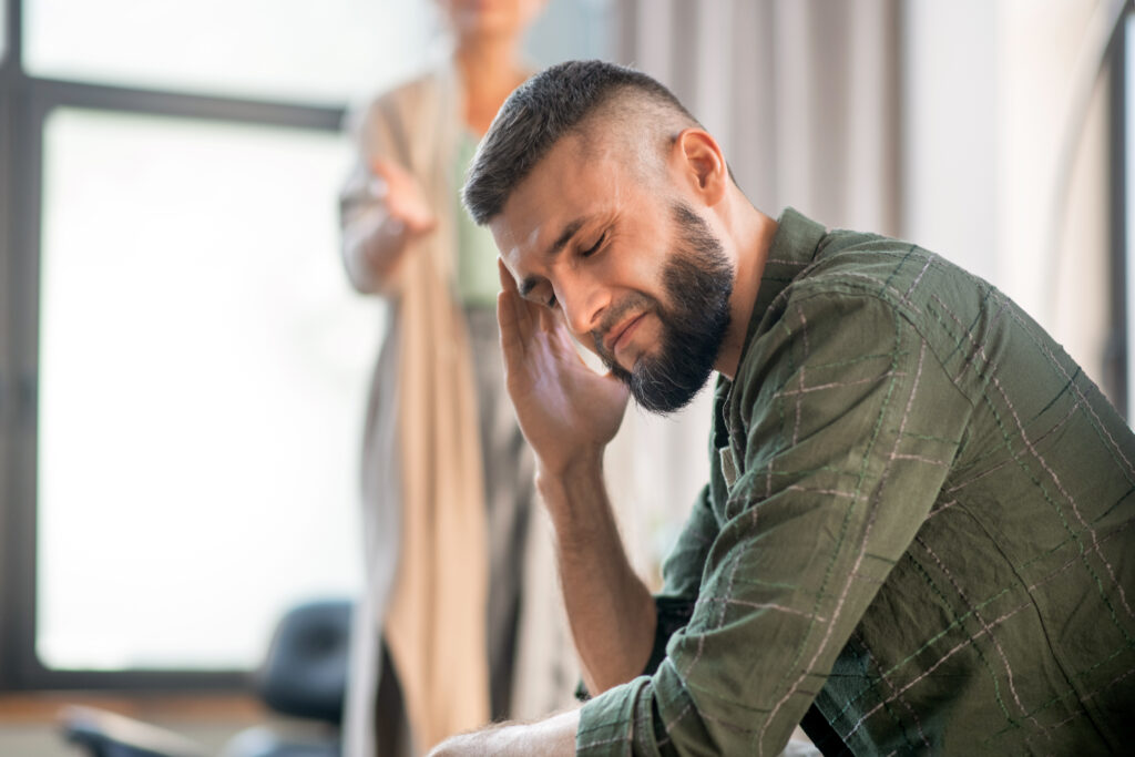 A man in emotional distress, showing signs of depression or anxiety that signal a need for support.